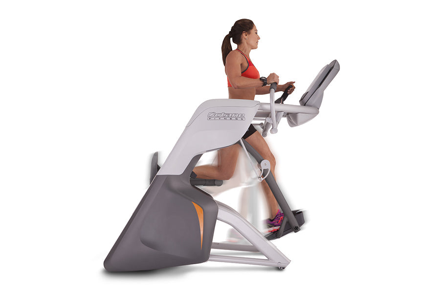Woman in red sports bra using gray and charcoal Octane Fitness ZR7000 Zero Runner exercise machine on white background