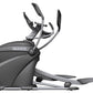Octane Q37x black and gray elliptical machine with curved handles and extended foot pedals on white background