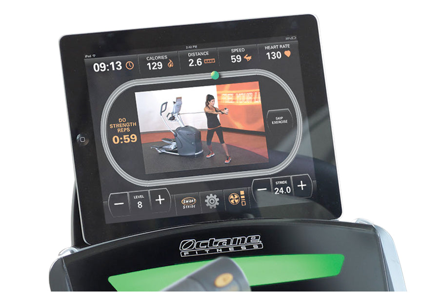 Octane Q47xi elliptical machine with tablet displaying workout metrics including calories, distance, speed, and heart rate du