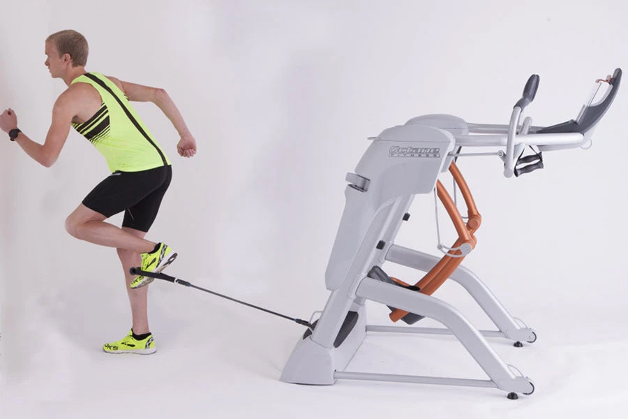 Man in neon yellow tank top running on white and orange Octane Fitness ZR8 Zero Runner machine against white background