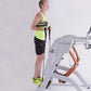 Man wearing neon yellow striped tank top and black shorts using white and orange Octane Fitness ZR8 Zero Runner machine again
