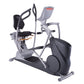 Gray and black seated elliptical exercise machine with dual handles, footrests, and digital display on white background
