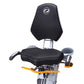 Black and gray stationary bike with padded seat and backrest, orange handlebars, and digital display on white background