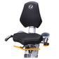 Octane xR6xi seated elliptical with black padded seat and backrest, silver metal frame, and yellow foot pedals on white backg
