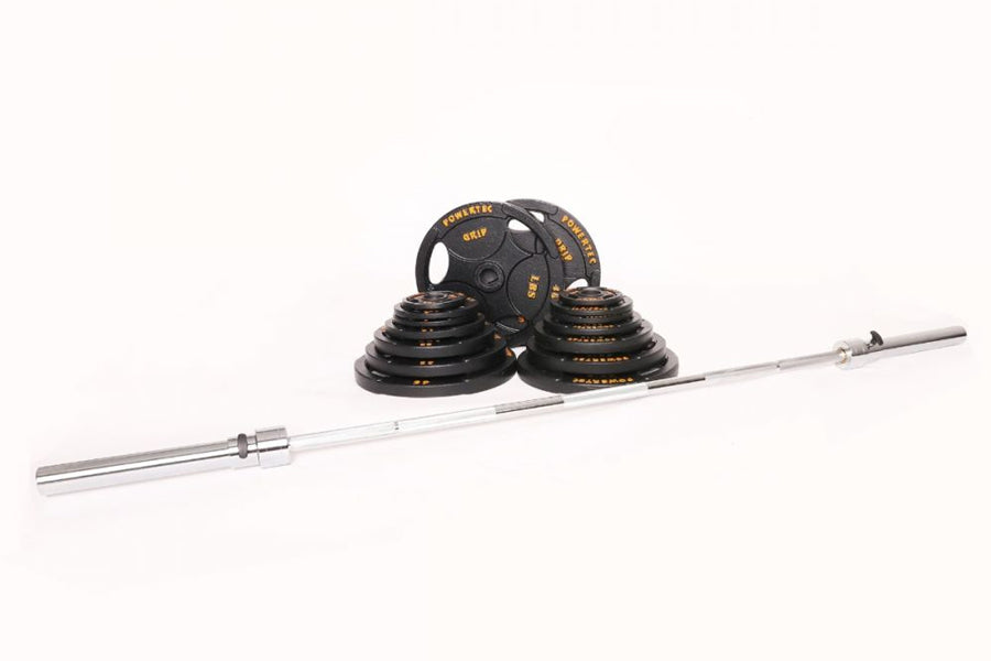 Olympic barbell weight set with black rubber-coated plates and gold text, silver bar, and collars on white background