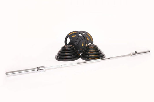 Olympic barbell weight set with black rubber-coated plates and gold text, silver bar, and collars on white background