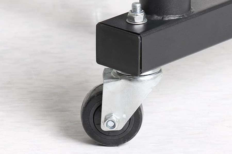 Black metal plate holder with swivel caster wheel and silver hardware on white background, close-up detail view