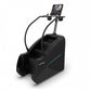 TRUE commercial stair climber with blue accent stripe, digital display console, and curved handrails on white background