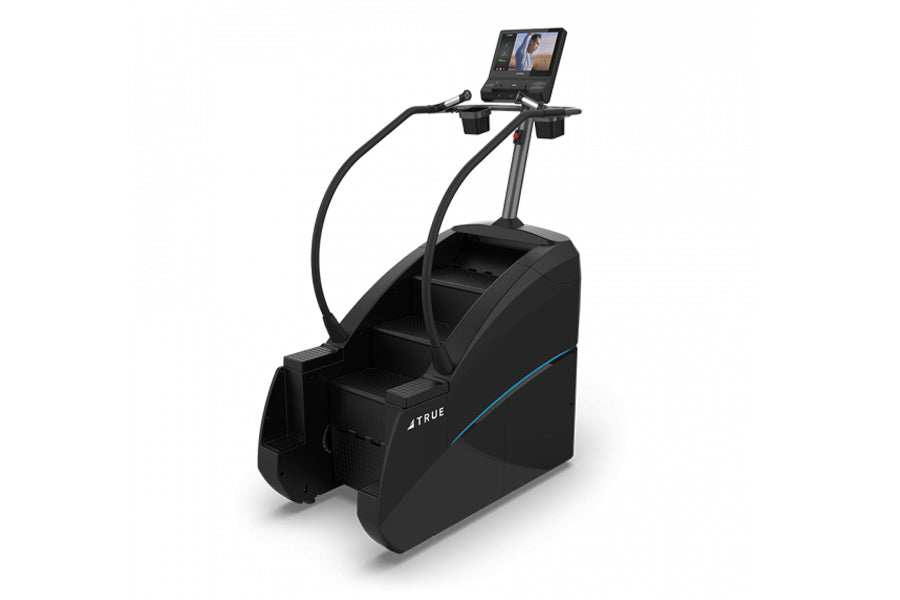 TRUE commercial stair climber with blue accent stripe, digital display console, and curved handrails on white background
