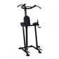 Black vertical power tower with padded seat, drop handles, and leg press footplates on white background