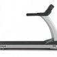 TRUE PS900 treadmill with black and silver frame, black running deck, and incline handles on white background