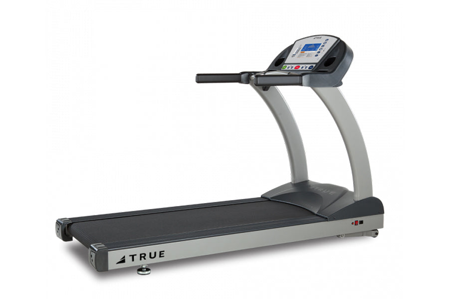 TRUE PS900 treadmill with gray uprights, black running deck, and digital display console on white background