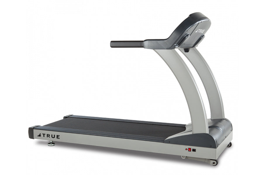 TRUE PS900 treadmill with black running deck, silver frame, and black handlebar on white background