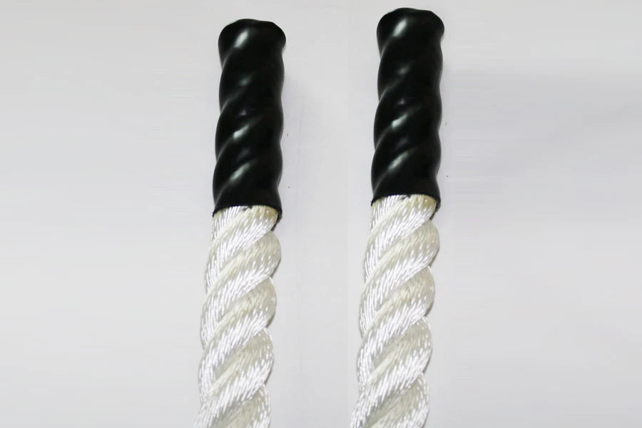 Pair of twisted white and cream poly ropes with black grip handles, flat lay on white background
