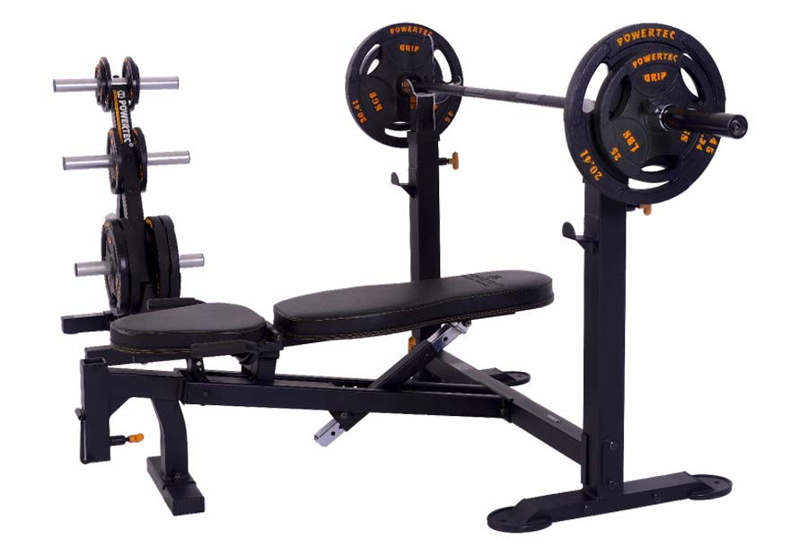 Powertec Workbench Olympic weight bench with black pad, barbell rack, and black weight plates on white background