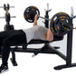 Man performing bench press on black Powertec Olympic weight bench with orange and black weight plates