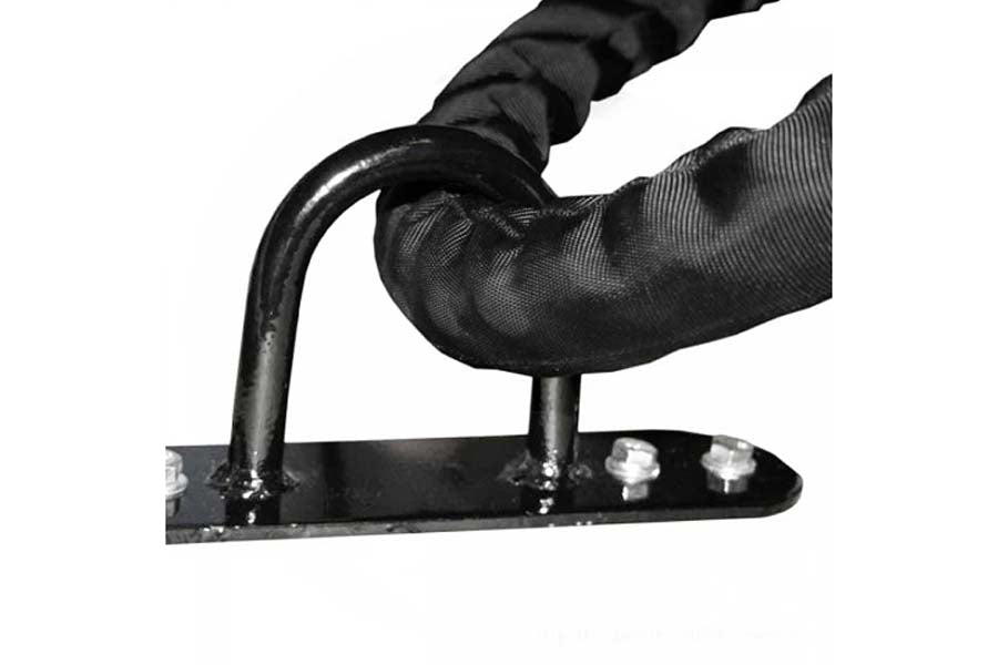 Black rope anchor attachment with curved metal handle and mounting plate, held in hand wearing black glove