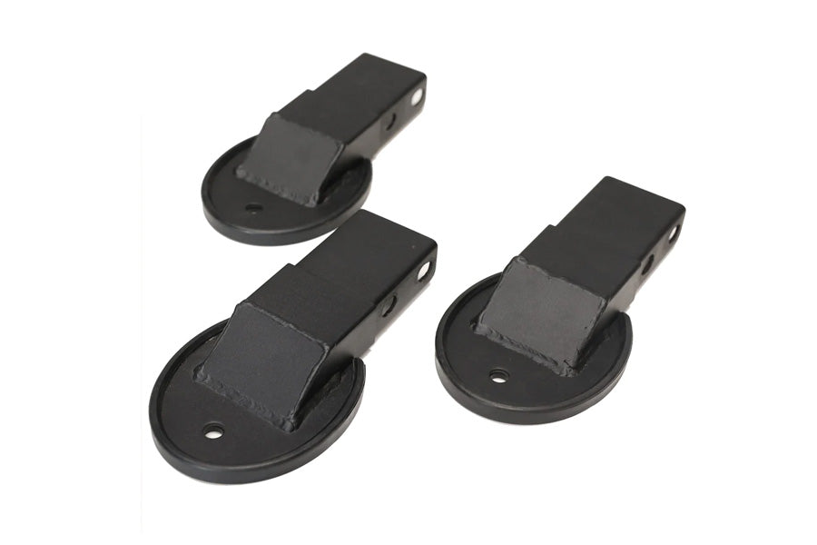 Three black metal footplates with suction cup bases and rectangular mounting arms, shown on white background
