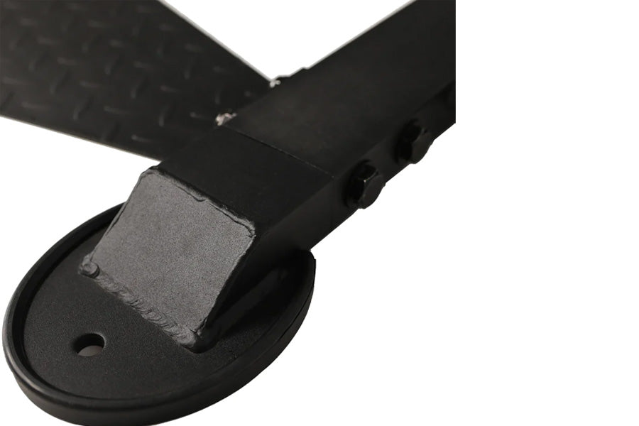 Black footplate with gray cushioned pad and adjustable strap for WorkBench LeverSystem, shown on white background