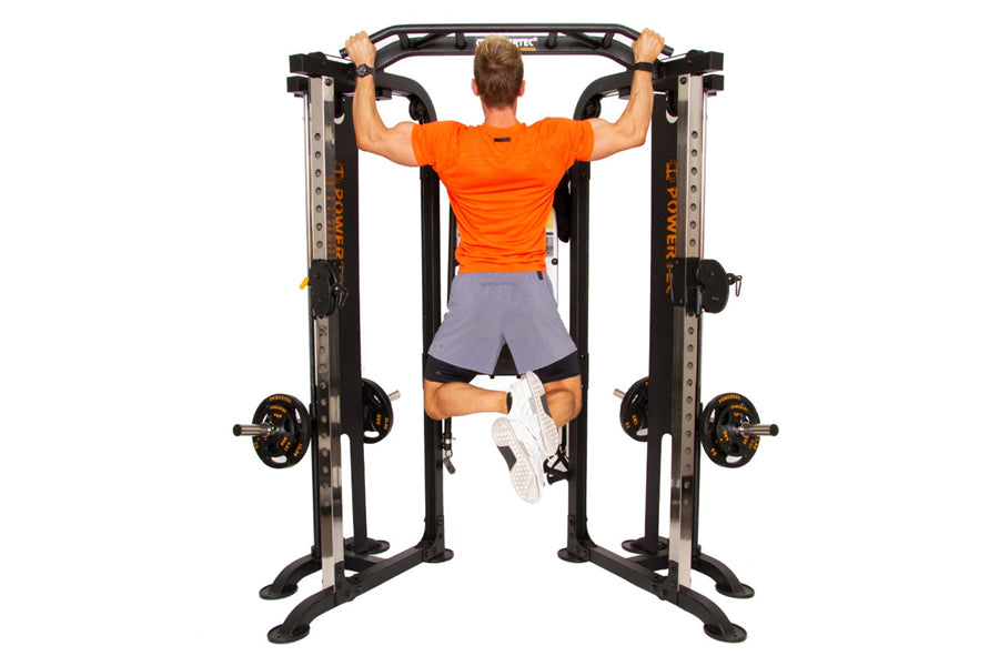Man using black and gold functional trainer machine with dual weight stacks, performing lat pulldown exercise