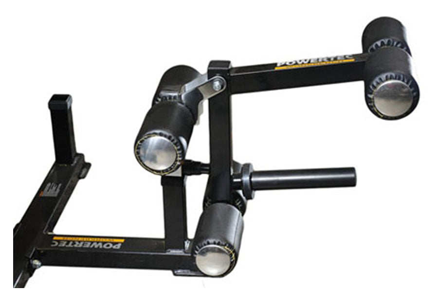 Black Powertec leg lift-curl attachment with adjustable padded rollers, metal frame, and handlebar on white background
