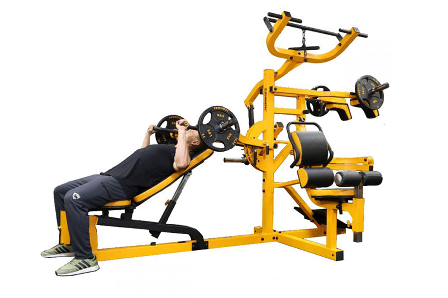 Yellow and black multifunction home gym with weight plates, displayed with model performing chest press exercise
