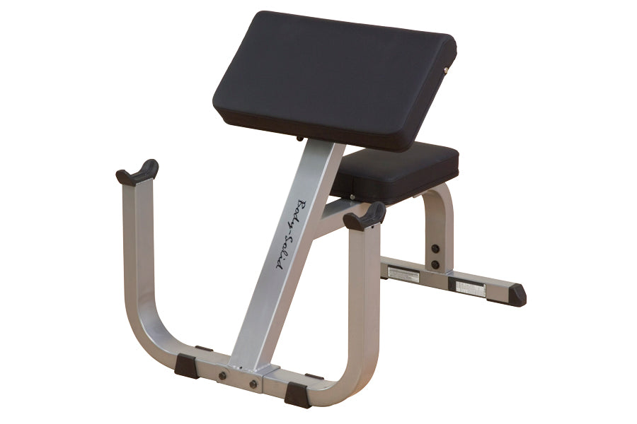 Body-Solid preacher curl bench with gray frame, black padded seat and back support, angled arm rest on white background
