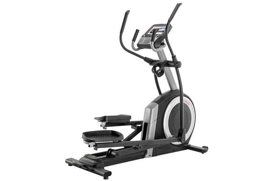 ProForm Carbon E10 elliptical trainer with black pedals, silver frame, digital console, and curved handlebar grips on white b