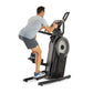 Man using black and gray ProForm elliptical machine with digital display, shown in side view against white background