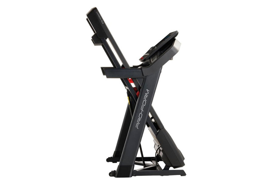 ProForm Carbon TLX black treadmill with dual incline columns and red accents, shown on white background
