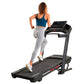 Woman running on ProForm Carbon TLX black treadmill with digital display, wearing blue sports bra and gray leggings