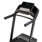 Black ProForm Carbon TL treadmill with digital display console, black frame, and cushioned running deck, front view on white 