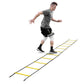 Man in gray t-shirt and black shorts training on yellow and gray agility ladder on white background