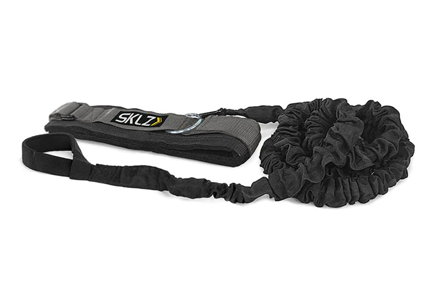 SKLZ Recoil 360° black training tool with padded shoulder strap and elastic cord, flat lay on white background