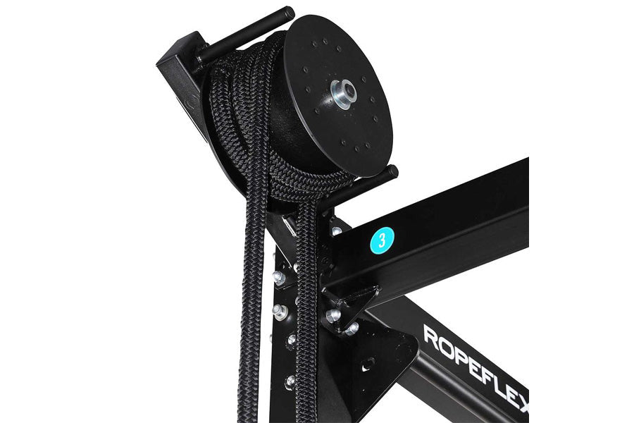 Black rope trainer with attached braided climbing rope and pulley system on white background