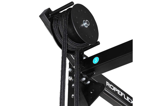 Black rope trainer with attached braided climbing rope and pulley system on white background