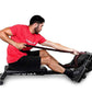 Man wearing red Ropeflex t-shirt and black shorts using black Ropeflex RX2200 horizontal rope trainer on white background