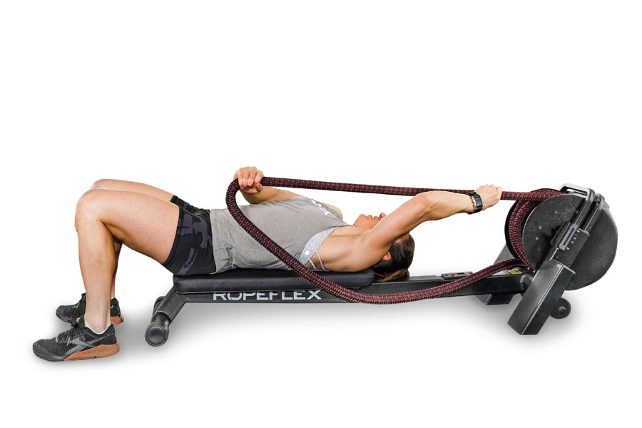 Man using Ropeflex RX2200 horizontal rope trainer with red and black rope, demonstrating abdominal exercise on white backgrou