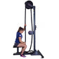 Woman using black upright rope trainer machine with dual pulleys, seated on bench, on white background