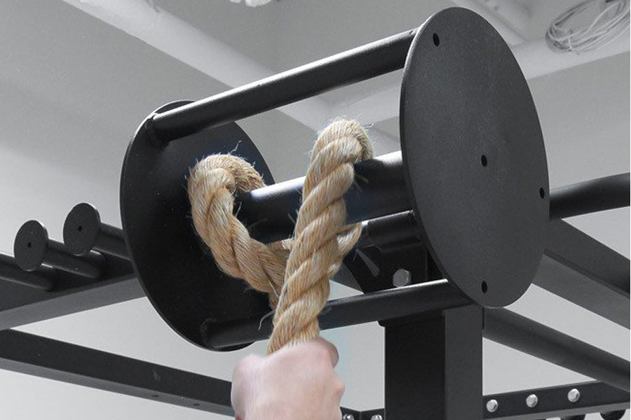 Warrior Rope Pull Attachment for Rig with natural jute rope and black metal construction mounted on bar