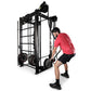 Man in red shirt using black steel cable machine trainer with dual weight stacks on white background