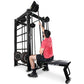 Man in red shirt using black Ropeflex RX2100 rope trainer machine with attached bench on white background