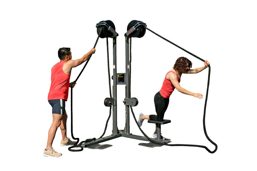 Ropeflex RX2500-D dual station rope trainer with two users in red shirts demonstrating rope exercises on gray metal frame
