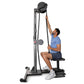 Man using black Ropeflex RX2500 upright rope trainer with pulley system and weighted ball, seated on attached bench