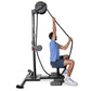 Man using black Ropeflex RX2500 upright rope trainer with pulley system, wearing blue shirt and navy shorts