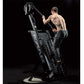 Shirtless man climbing black Ropeflex RX4400 rope trainer with overhead rope attachment on black background