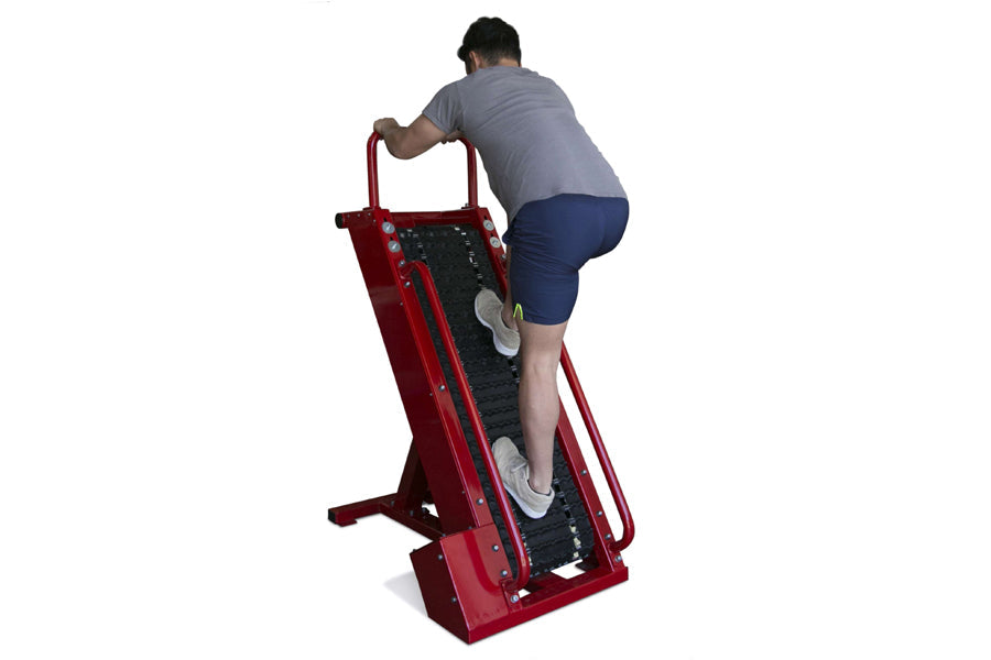 Man using red and black Ropeflex Infinity Tread Climber with dual footplates, worn by model on white background