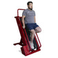 Man using red Ropeflex stair climber machine in gray t-shirt and navy shorts on white background