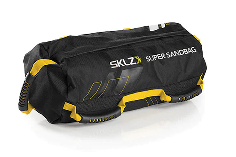 SKLZ Super Sandbag in black nylon with yellow accents, featuring dual handles and reinforced stitching on white background