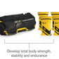 Black and yellow SKLZ Super Sandbag with carrying handles, shown with four 10-pound yellow and black weight inserts on white 